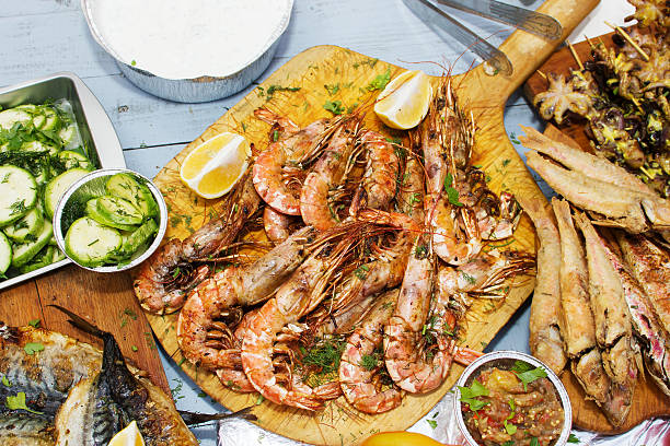 istock Grilled shrimps on wooden table. 612713872