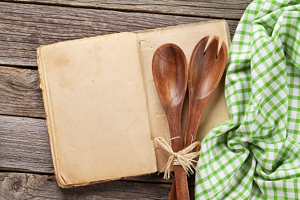 istock Blank vintage recipe cooking book and utensils 612715452