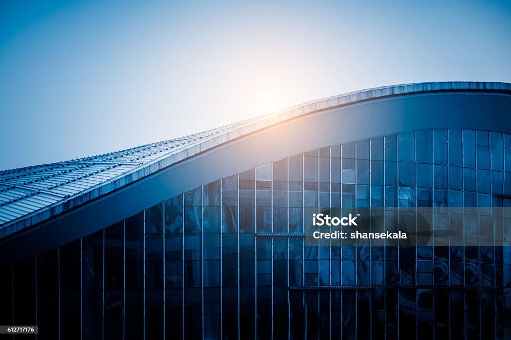 sunlight shine at modern building roof detail of modern building,blue toned,china. Building Exterior Stock Photo