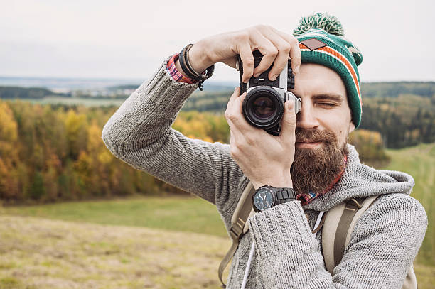 istock Young man photographer looking to camera 612718452