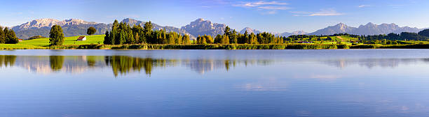istock panorama landscape in Bavaria with mountains mirroring in lake 612719834