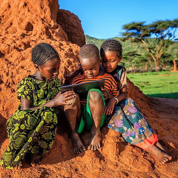 istock Little African children using digital tablet, East Africa 612721224
