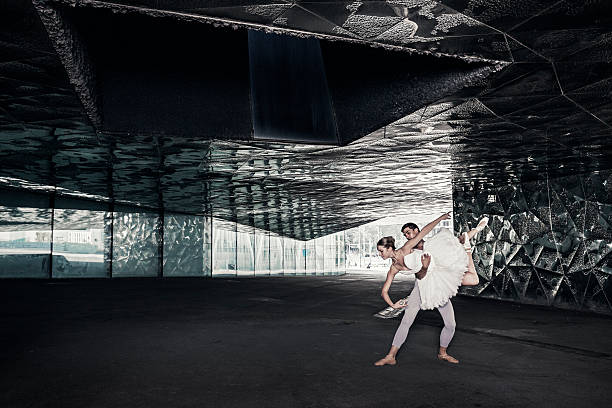 Ballet dancers performing in the city streets of Barcelona The building is in public property at the Barcelona Forum area See: https://www.google.es/maps/place/F%C3%B2rum,+08019+Barcelona/@41.4113761,2.2198059,3a,75y,115.57h,92.54t/data=!3m8!1e1!3m6!1s-teC52cw0N0w%2FVx0v1Tth8UI%2FAAAAAAAAA4w%2F0Ld2Bte2sLgyPGCCifIneQ0hM0fGjScxACLIB!2e4!3e11!6s%2F%2Flh3.googleusercontent.com%2F-teC52cw0N0w%2FVx0v1Tth8UI%2FAAAAAAAAA4w%2F0Ld2Bte2sLgyPGCCifIneQ0hM0fGjScxACLIB%2Fw203-h101-n-k-no%2F!7i8704!8i4352!4m5!3m4!1s0x12a4a35722dbb207:0x991a23a37c13b0f0!8m2!3d41.411828!4d2.21985?hl=en