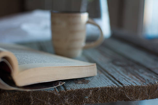 istock Coffee and a book and houseplant 612723758