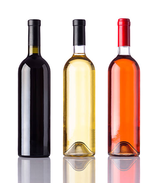 botellas de vino aisladas sobre fondo blanco - vertical color image nobody collage fotografías e imágenes de stock
