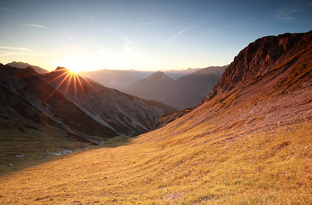istock autunm sunrise over mountains in Alps 612724826