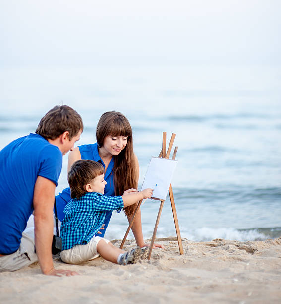 istock Family resting on the sea. 612726184