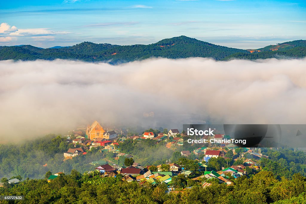 Landscape of houses on the mountain on foggy day Landscape of houses on the mountain on foggy day in early morning at Da Lat, Vietnam Dalat Stock Photo
