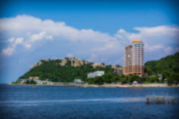 istock Brearley sea, mountains and sky background skyscraper. 612727700