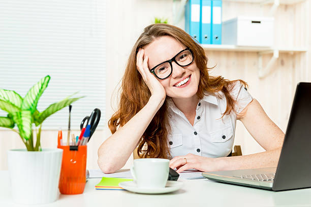 istock happy and beautiful successful accountant working in the office 612728174