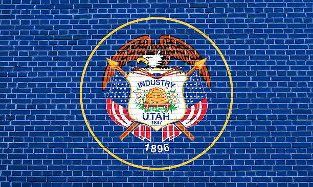 istock Flag of Utah on brick wall texture background 612729140
