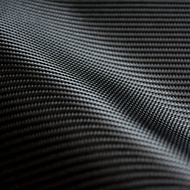istock Carbon fiber composite raw material background 612729430