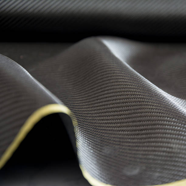 istock Carbon fiber composite raw material background 612729482