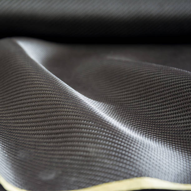 istock Carbon fiber composite raw material background 612729612