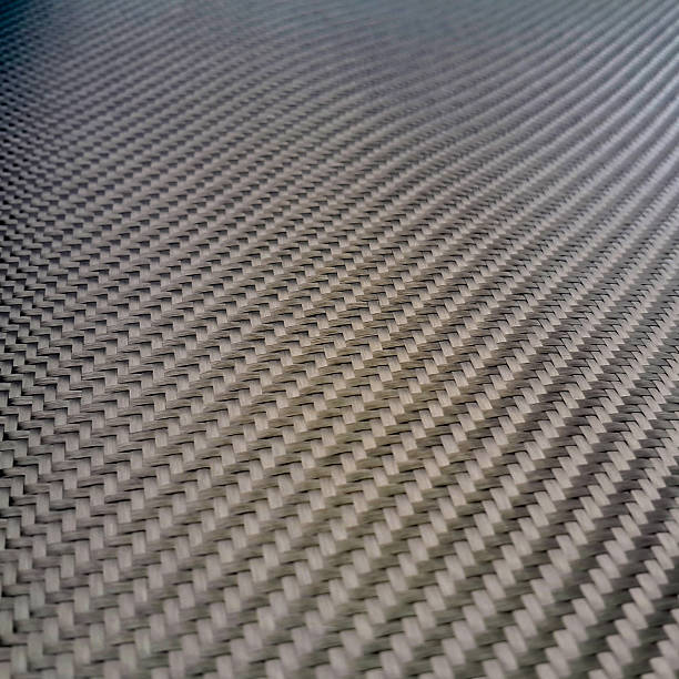 istock Carbon fiber composite raw material background 612729622