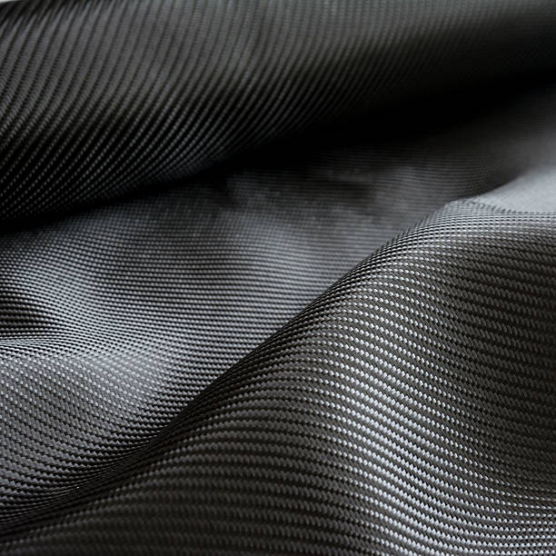 istock Carbon fiber composite raw material background 612729676