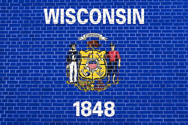 istock Flag of Wisconsin on brick wall texture background 612729838