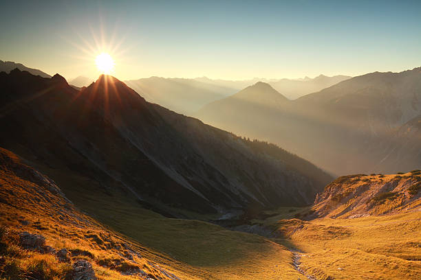 istock sunrise in rocky Alps 612730064