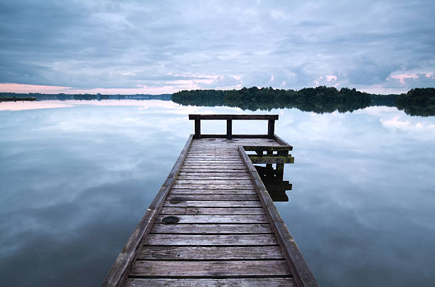 istock wooden pier on big lake 612730344