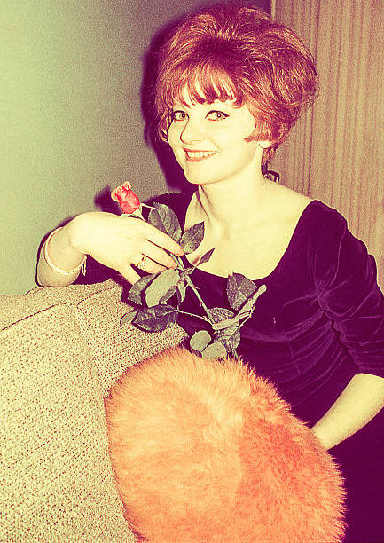 istock Vintage woman with a rose 612730388