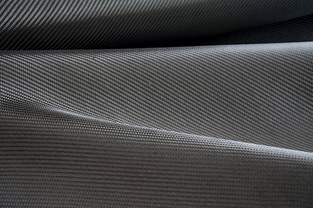 istock Carbon fiber composite raw material background 612731066