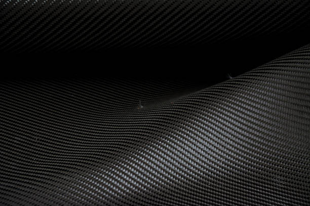 istock Carbon fiber composite raw material background 612731134