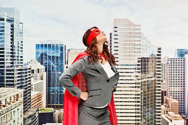 istock Superhero looking up outdoors in the city 612731218