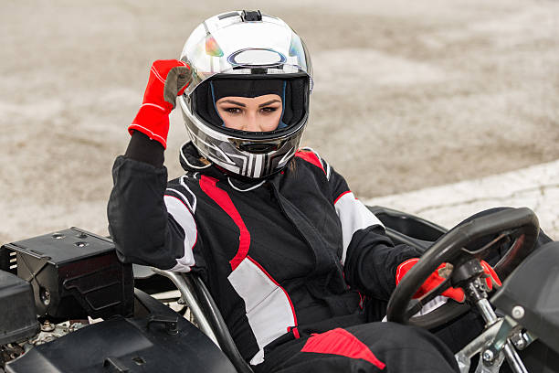 istock Female go-kart racing champion celebrating 612731748