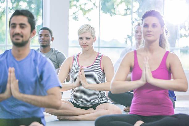 istock Meditating Together During Yoga 612732234
