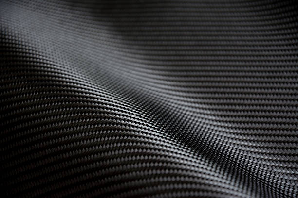 Carbon fiber composite raw material background Black carbon fiber composite raw material background motorsport photos stock pictures, royalty-free photos & images