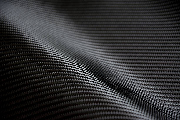 włókno węglowe tło złożone surowców - carbon fiber textile pattern zdjęcia i obrazy z banku zdjęć