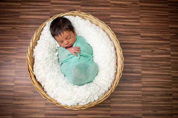 istock Newborn Baby Boy in a Basket 612734328