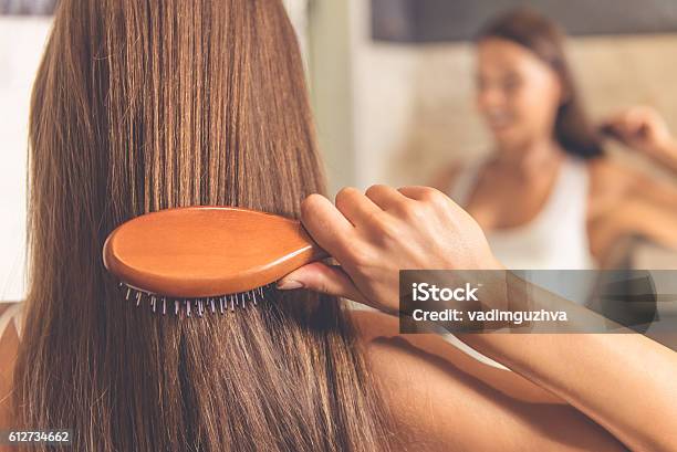 Beautiful Woman In Bathroom Stock Photo - Download Image Now - Hairbrush, Human Hair, Combing