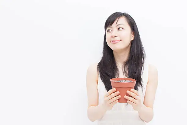 Japanese woman holding a plantpot