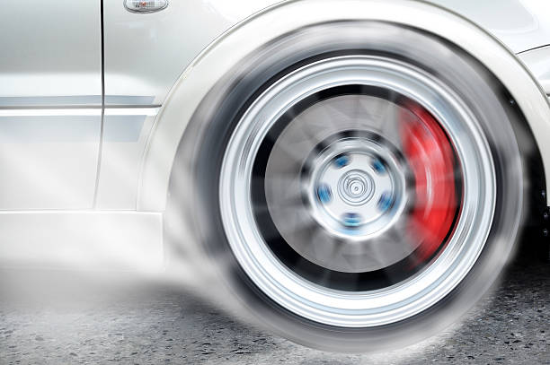 partial shot of a modern rim and tire, diagonally from the side