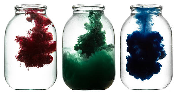 istock RGB paint swirling in water. 612735632