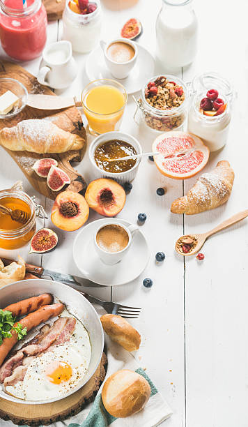 istock Breakfast snacks and drinks set on white wooden background 612735886