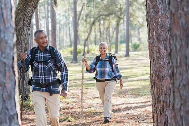 istock African American seniors hiking through woods 612737664