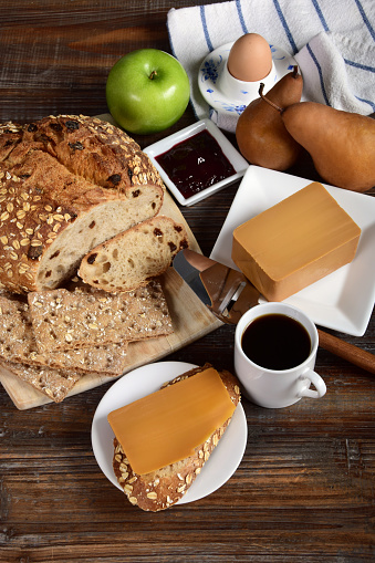 Hearty breakfast with traditional Norwegian brown cheese made from whey, called Brunost or Gjetost.