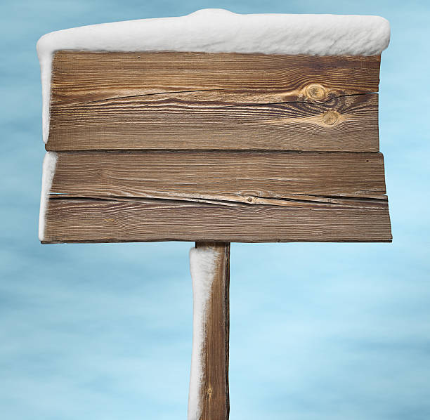 istock Wooden sign with snow 612738170