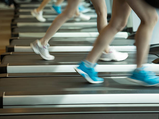 istock Women running on treadmill 612738644