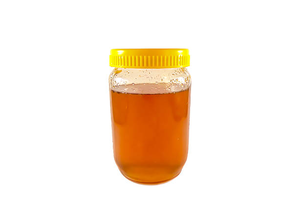 istock Jar of meadow honey-isolated 612740504