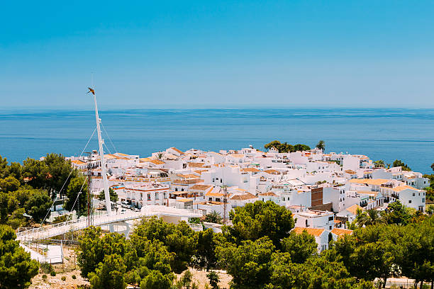istock Mediterranean architecture - white houses in Nerja, Spain 612741100