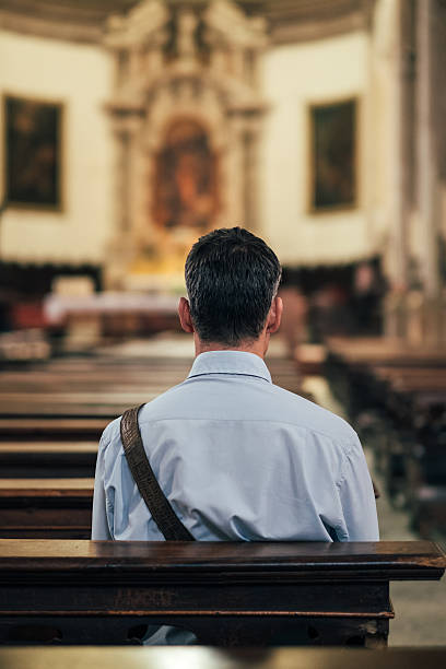 istock Man sitting at Church 612743824