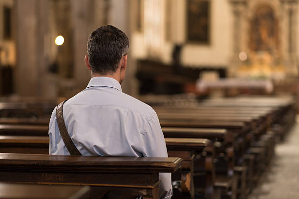 istock Man sitting at Church 612743858