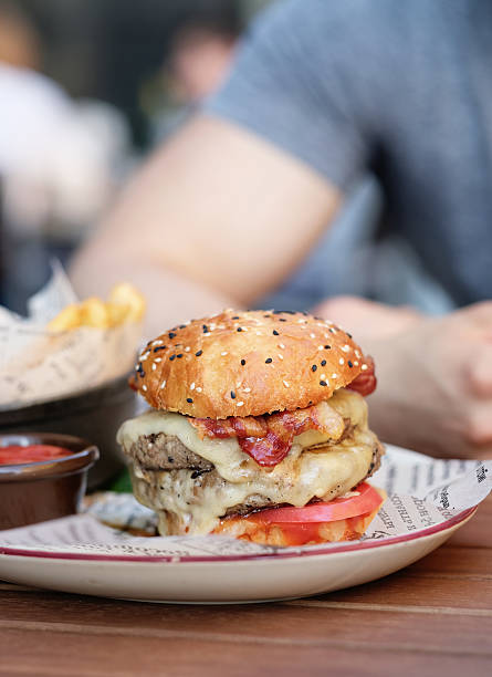 istock Cheeseburger in outdoor restaurant 612744536