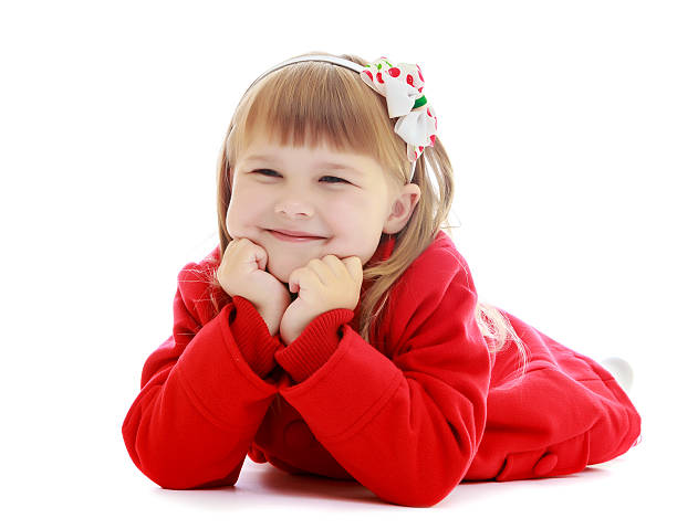 istock Happy girl lying on the floor 612744790