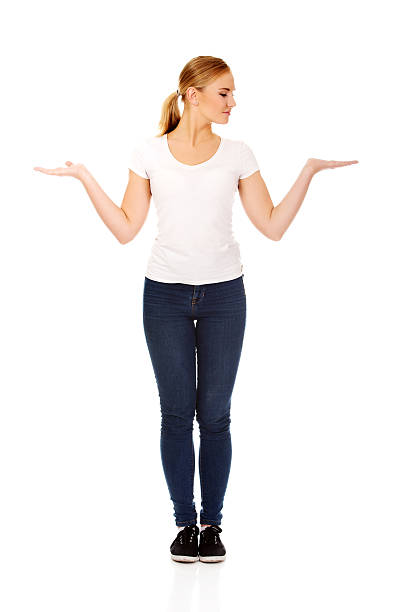 istock Young woman presenting something on open palms 612746944