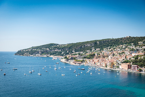 Villefranche-sur-Mer, France - August 11, 2015: View of the stunning bay of Villefranche-sur-Mer on a sunny summer day in France