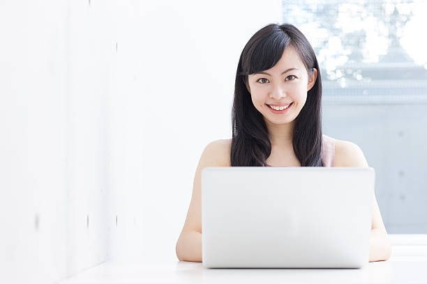 istock Japanese woman using a laptop 612747886
